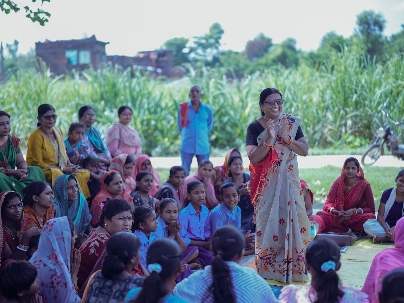 Women and children gathered for a community education meeting
