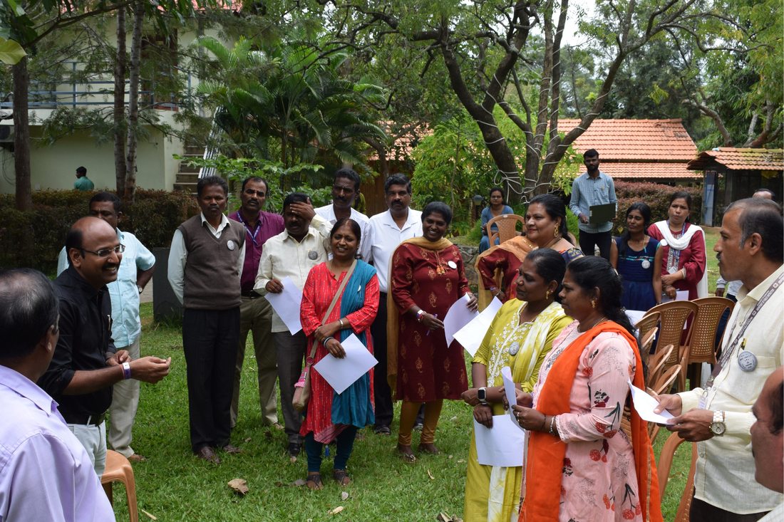 Teachers and education officials in an outdoor training session